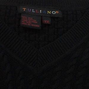 Black v neck sweater vest.